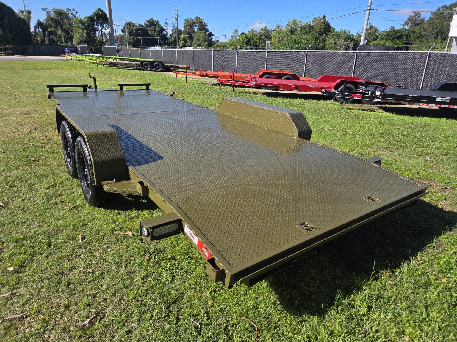 Olive green steel deck trailer, rear view