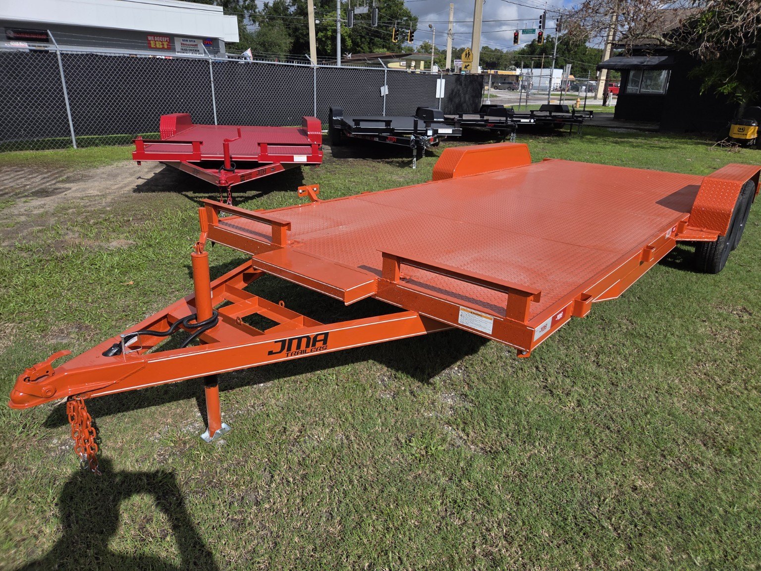 Orange steel deck trailer, front view