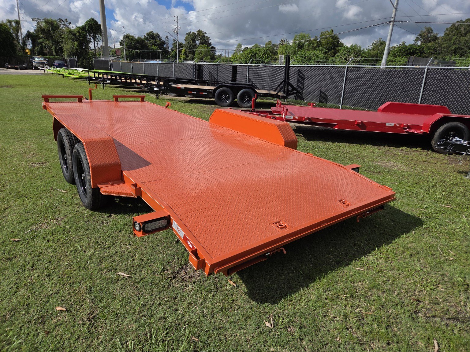 Orange steel deck trailer, rear view